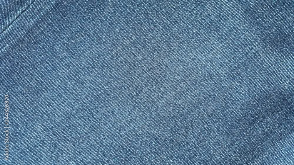 Blue denim jeans fabric slow rotating. Jeans texture, textile background. Stock video footage. Blue denim jeans fabric slow rotating. Jeans texture, textile background. Stock video footage.