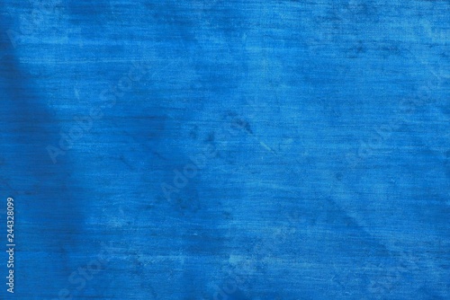 blue fabric texture from a piece of dirty tarpaulin