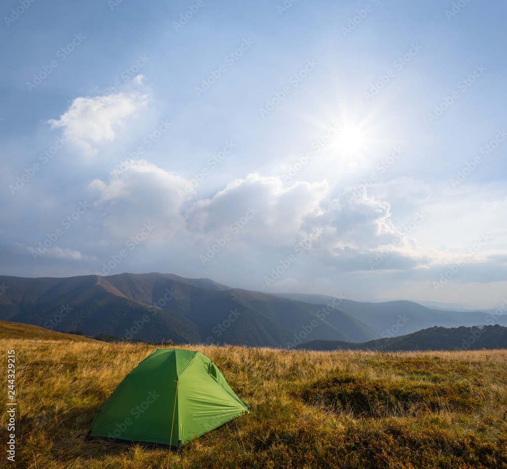 green touristic tent stay among a mountain plateau, mountain touristic camp scene