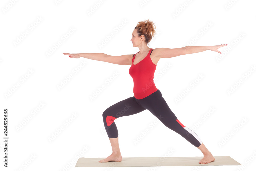 Beautiful Yoga: Senior Woman doing Virabhadrasana Warrior one pose