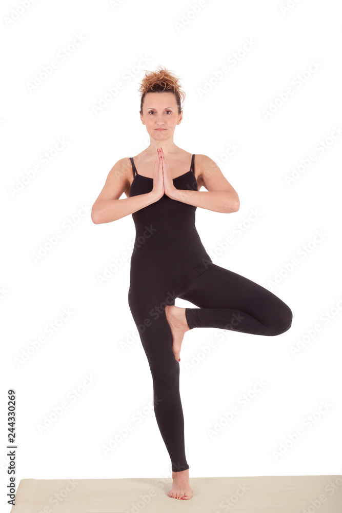 Beautiful Yoga: Senior Woman doing Vrikshasana, The Tree Pose Beautiful Yoga: Senior Woman doing Vrikshasana, The Tree Pose