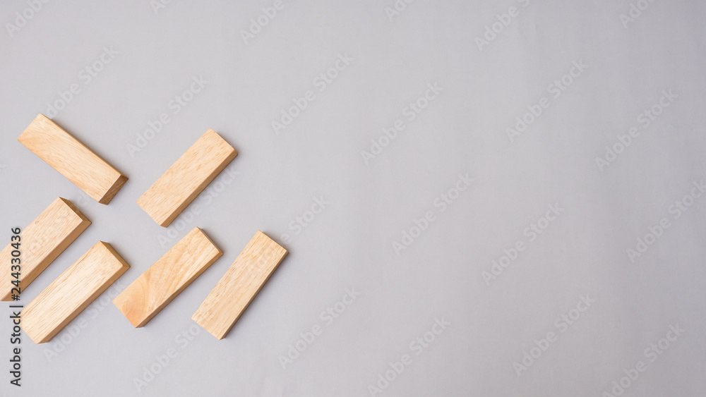 Wood block stacking.Business concept on gray background Wood block stacking.Business concept on gray background