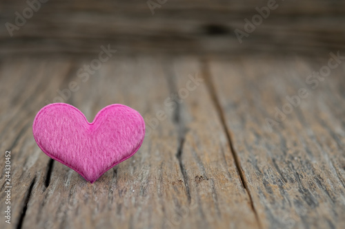 One Heart on wooden background. Copy space Valentines.