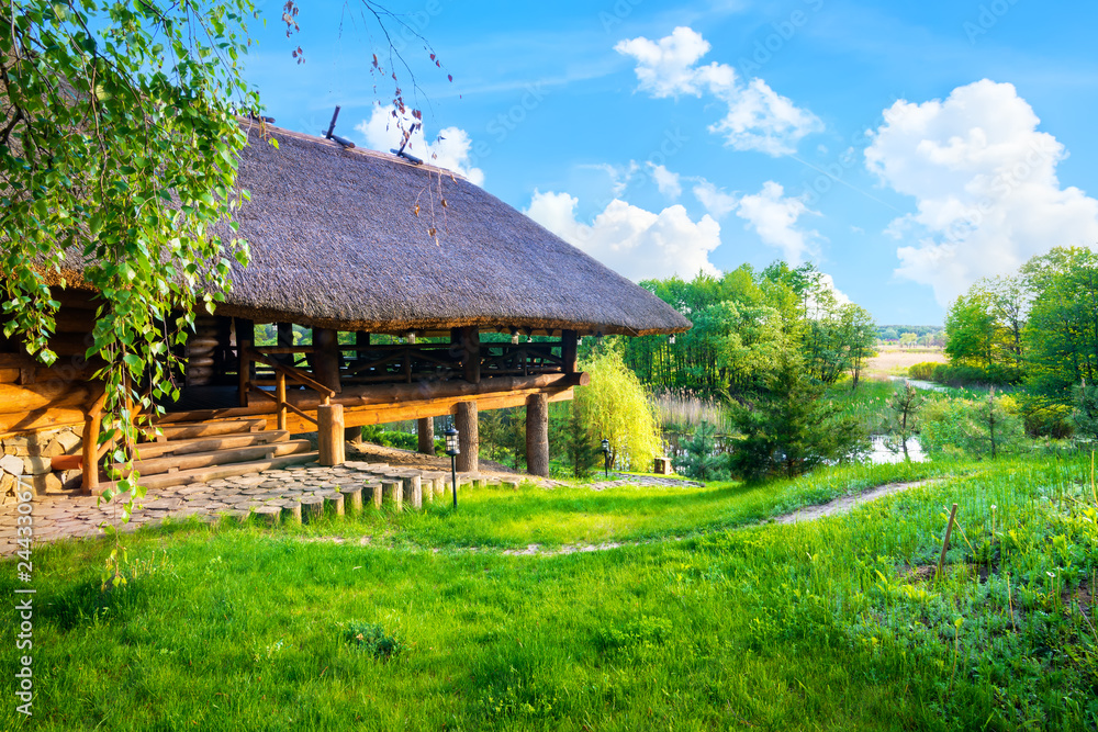 Fototapeta premium Wooden house in summer