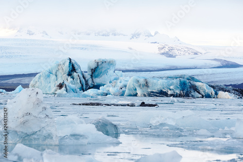 Ice blocks at lagoon Jokulsarlon with mountain in background