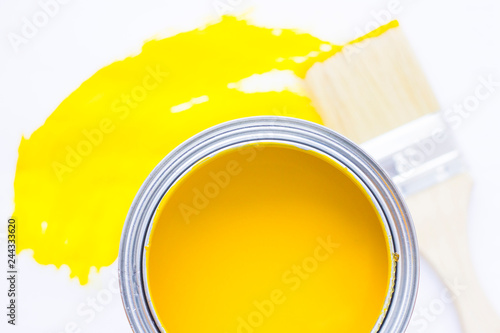 House renovation concept, colorfull paint cans and paintbrushes on wooden background