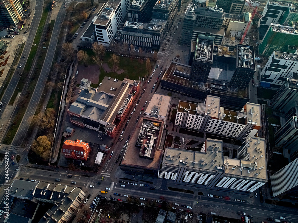 WARSAW, POLAND - NOVEMBER 27, 2018: Beautiful panoramic aerial drone view to the center of Warsaw City near The Warsaw Spire - 220 metre neomodern office building on European square (Plac Europejski)