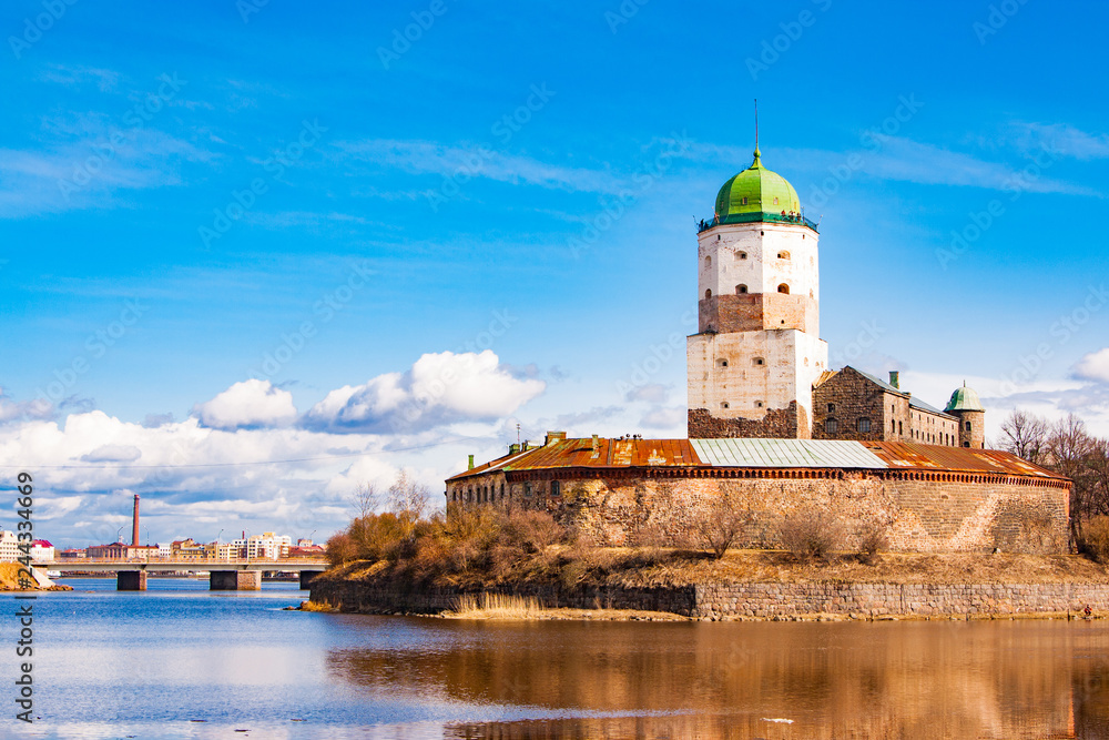 Sightseeing of Russia. Beautiful spring view to historical Vyborg ancient castle - medieval, famous fort in Vyborg town, a popular architectural landmark, LEningrad Region, Vyborg, Russia.