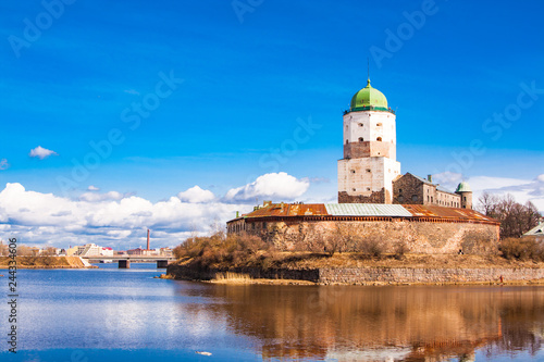 Sightseeing of Russia. Beautiful spring view to historical Vyborg ancient castle - medieval, famous fort in Vyborg town, a popular architectural landmark, LEningrad Region, Vyborg, Russia.