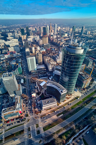 WARSAW  POLAND - NOVEMBER 27  2018  Beautiful panoramic aerial drone view to the center of Warsaw City and The Warsaw Spire - 220 metre neomodern office building on European square  Plac Europejski 