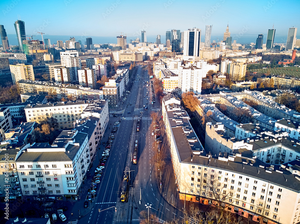 Obraz premium WARSAW, POLAND - NOVEMBER 27, 2018: Beautiful panoramic aerial drone view to the center of Warsaw City and Roman Catholic Parish of St. James the Apostle at Narutowicza Square, Ochota district