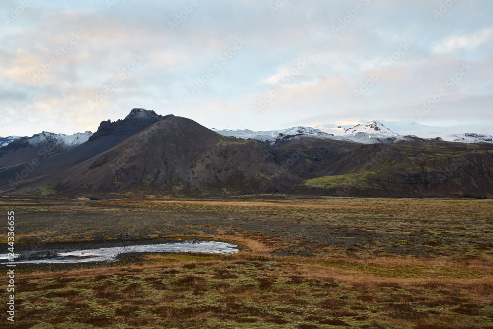 National Park Landmannalaugar. On the gentle slopes of the mountains are snow fields and glaciers. Magnificent Iceland in November