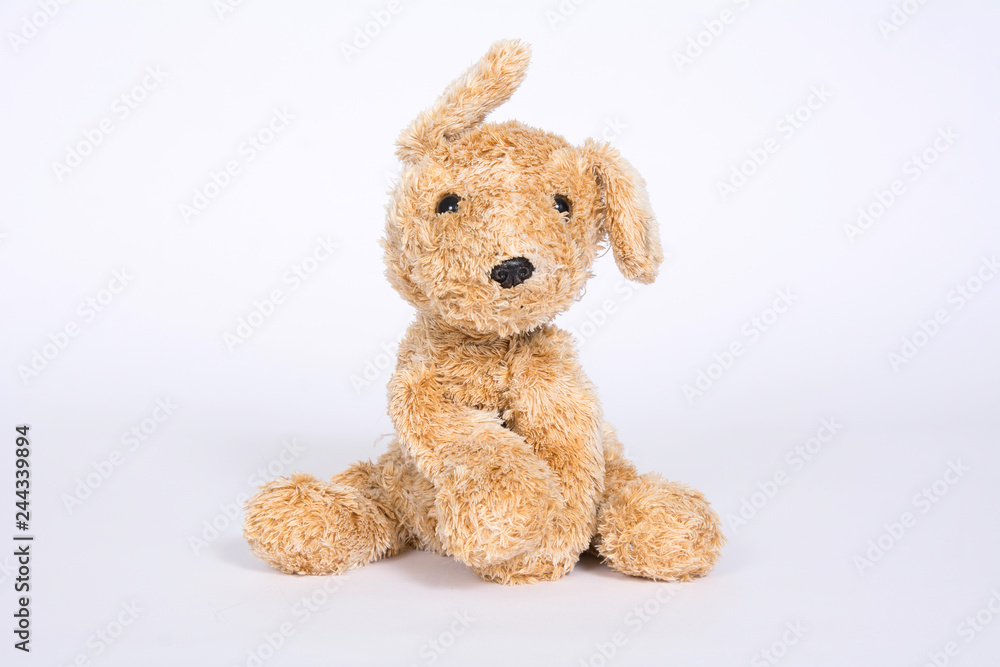 Soft toy dog with raised ears isolated on white background Soft toy dog with raised ears isolated on white background
