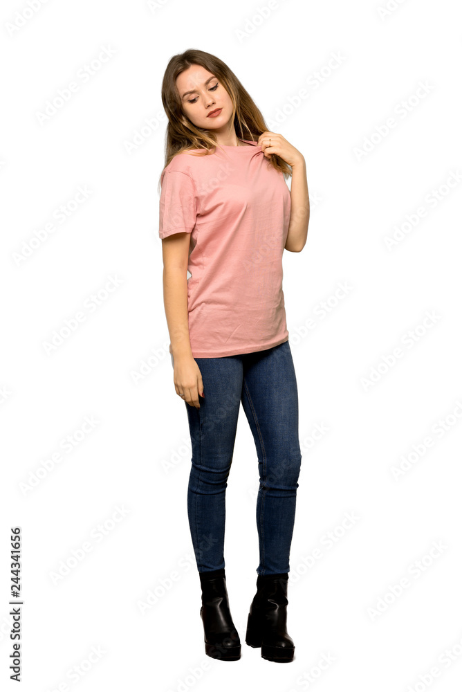 Obraz premium A full-length shot of a Teenager girl with pink sweater with a lot of heat on isolated white background