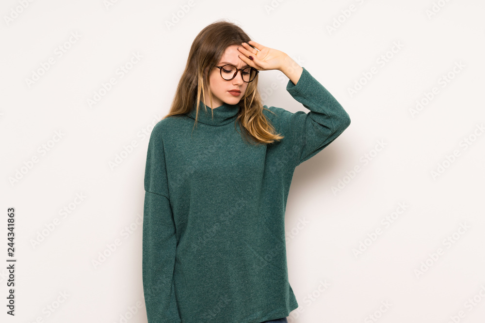 Teenager girl over white wall with tired and sick expression Teenager girl over white wall with tired and sick expression