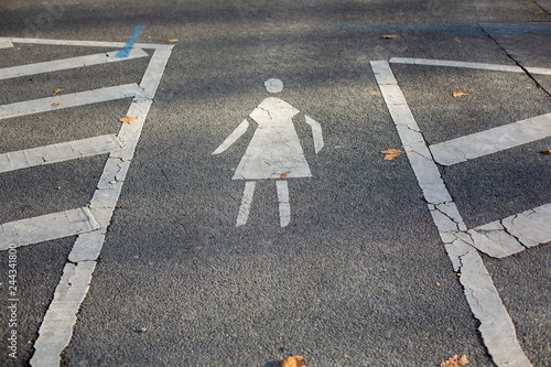 Fototapeta Naklejka Na Ścianę i Meble -  Pedestrian crossing with symbol on a small street in Berlin.
