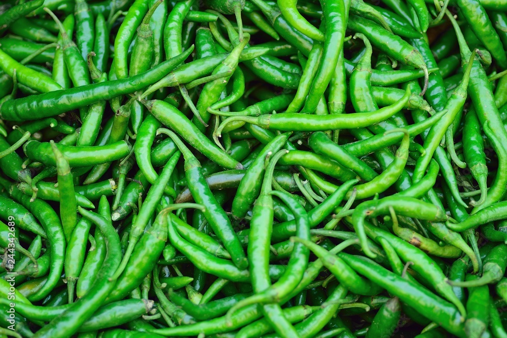 Macro details of Fresh Green Chilies at street side vegetable market in India Macro details of Fresh Green Chilies at street side vegetable market in India