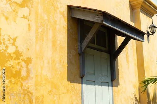 Backgrounds Old wooden windows on the yellow wall