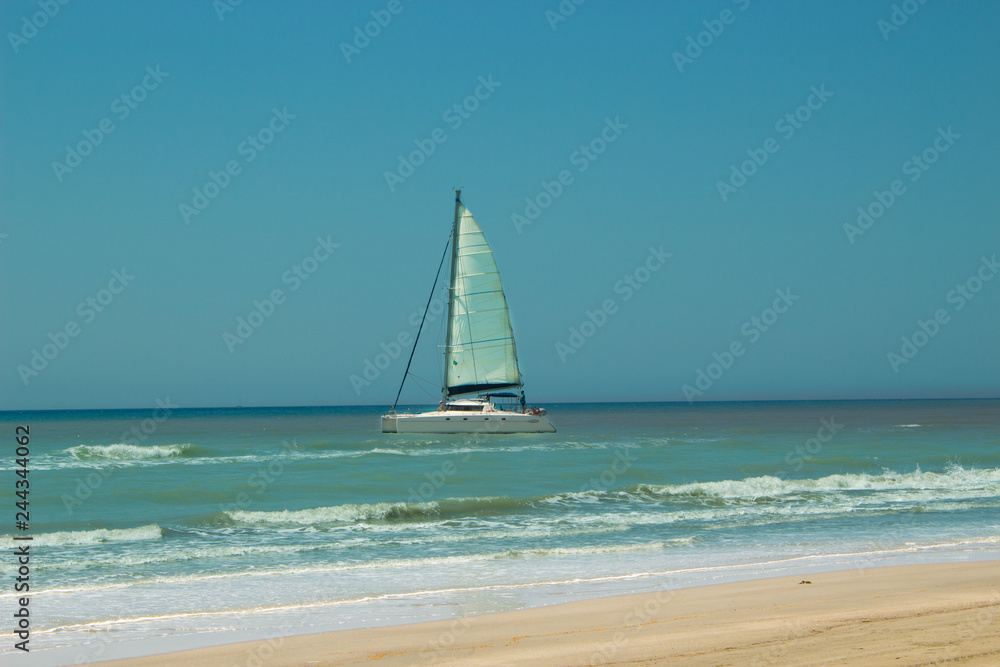 Obraz premium Sailing boat in the Mediterranean sea. 20 km long sandy beach of Patara. Turkey