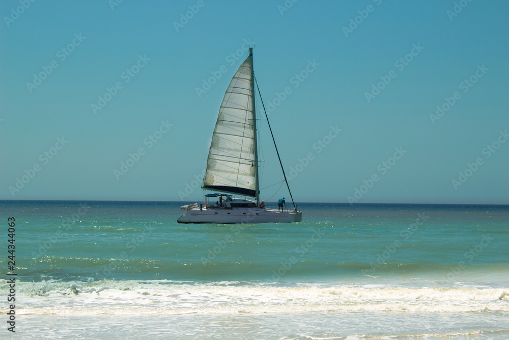 Fototapeta premium Sailing boat in the Mediterranean sea. 20 km long sandy beach of Patara. Turkey