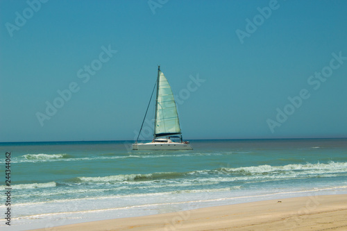 Sailing boat in the Mediterranean sea. 20 km long sandy beach of Patara. Turkey