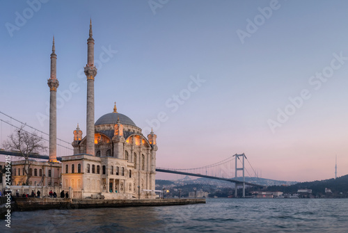 Ortakoy Mosque with Bosphorus Bridge in Istanbul during the sunset.