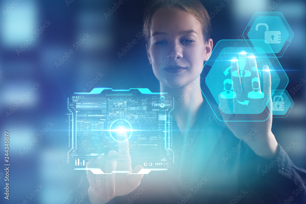 The concept of business, technology, the Internet and the network. A young entrepreneur working on a virtual screen of the future and sees the inscription: The concept of business, technology, the Internet and the network. A young entrepreneur working on a virtual screen of the future and sees the inscription: