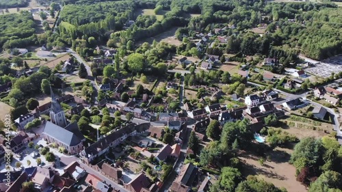 Aerial panoramic shot of a French village lost in the forest taken from a drone