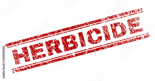 HERBICIDE seal print with corroded effect. Red vector rubber print of HERBICIDE text with corroded texture. Text tag is placed between double parallel lines.