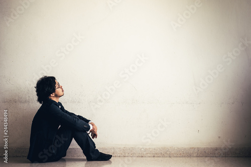 Portraits of Asian businessman stressed from work.anxiety in adult cause to depression and a problem in living that drag you down to feeling sadness,lonely and worried.