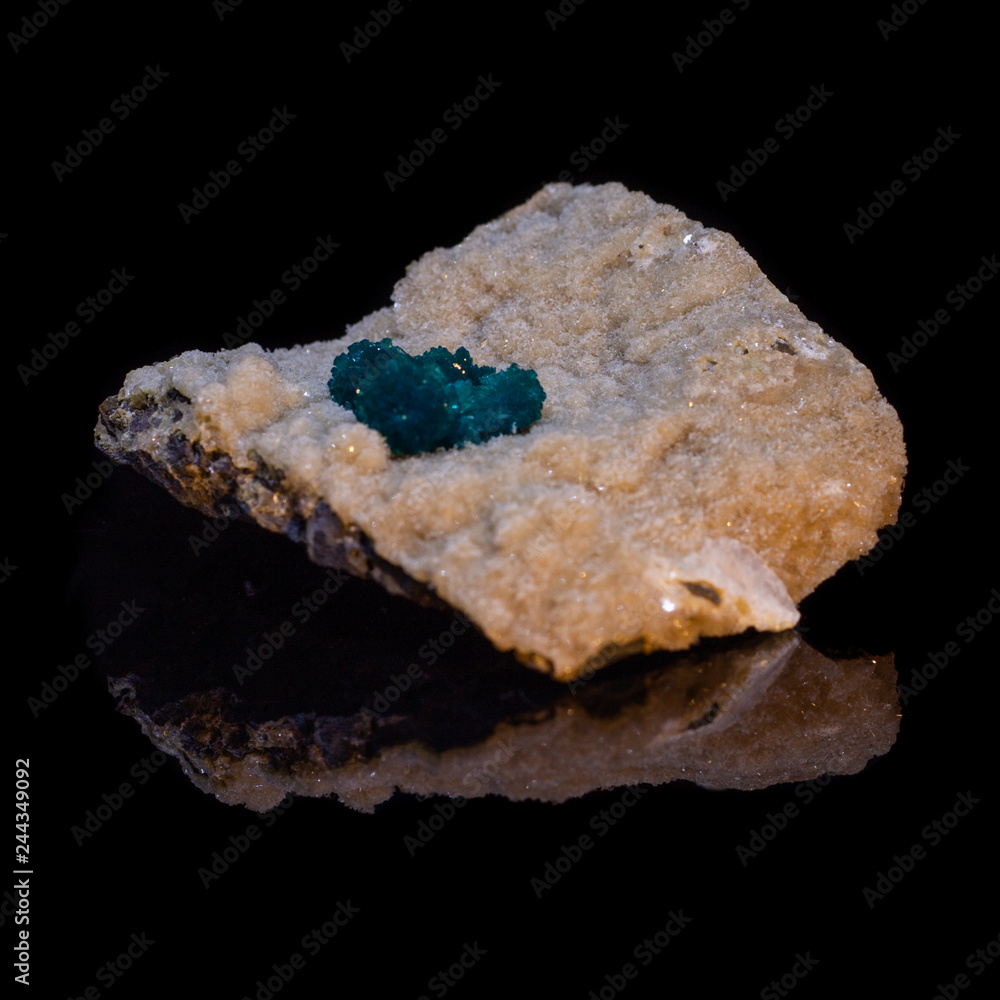 Natural cavansite stone on substrate on black background with reflection Natural cavansite stone on substrate on black background with reflection
