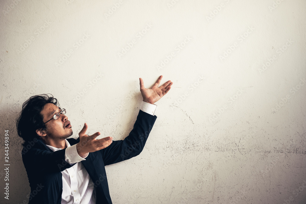 Portraits of Asian businessman stressed from work.anxiety in adult cause to depression and a problem in living that drag you down to feeling sadness,lonely and worried. Portraits of Asian businessman stressed from work.anxiety in adult cause to depression and a problem in living that drag you down to feeling sadness,lonely and worried.