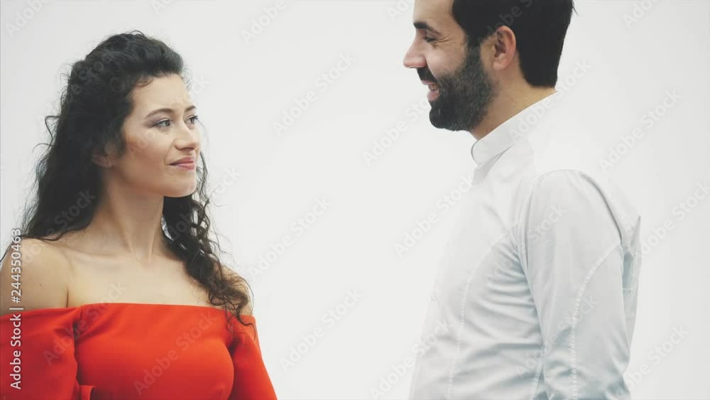 Beautiful romantic couple isolated on white background. Attractive young woman and handsome hand hug with red heart. Happy Valentine Kiss. Beautiful romantic couple isolated on white background. Attractive young woman and handsome hand hug with red heart. Happy Valentine Kiss.