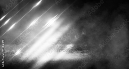 Black background of empty street, room, spotlight illuminates asphalt, laser beams, smoke