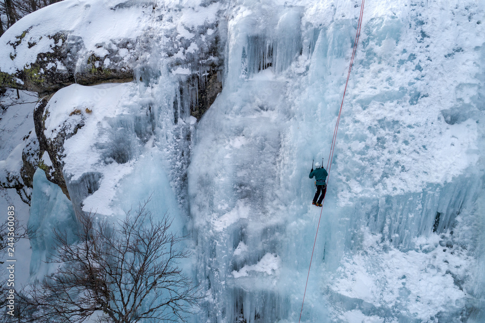 Ice climbing the North Greece, man climbing frozen waterfall. Ice climbing the North Greece, man climbing frozen waterfall.