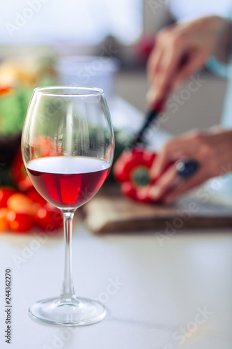 Selective focus of a glass with red wine