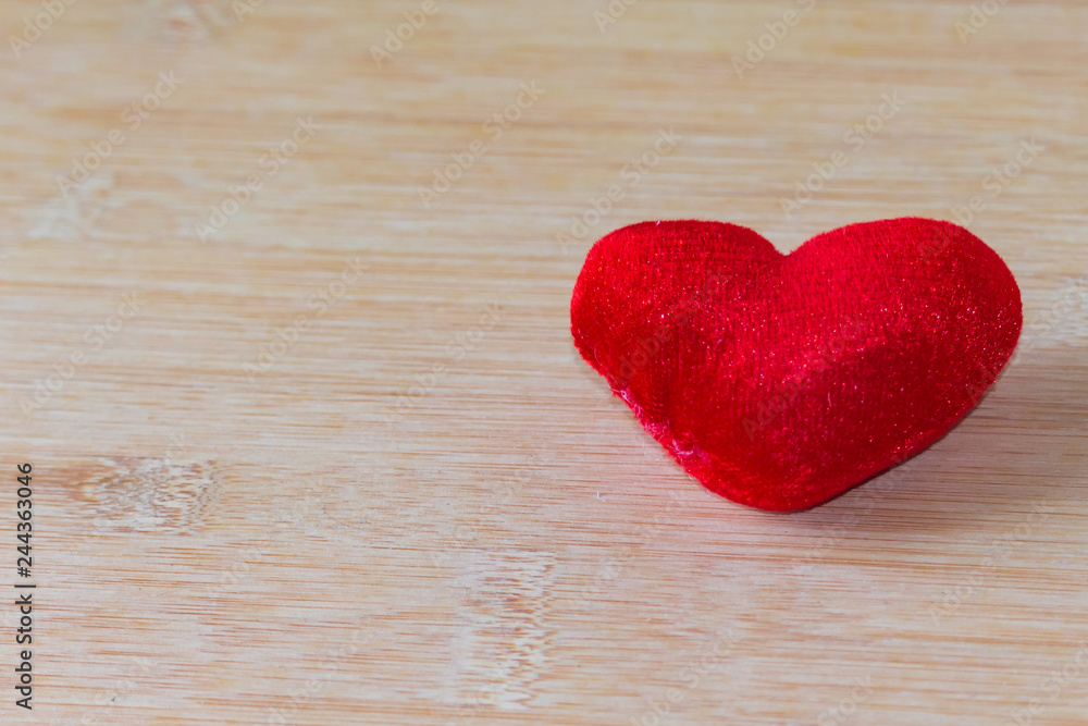 Obraz premium Red heart on the wooden floor For Valentine's Day