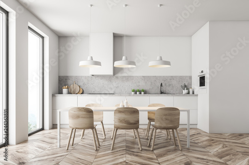 White kitchen with wooden table © ImageFlow