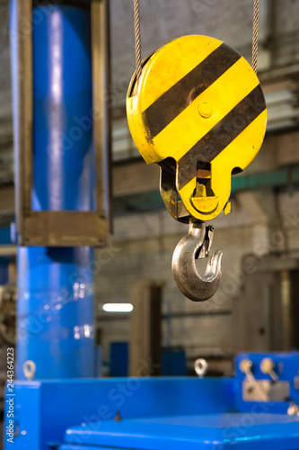 Close up hook crane of overhead crane in factory, machine part concept