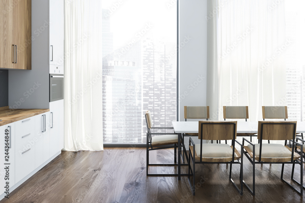 White and gray kitchen interior with long table White and gray kitchen interior with long table