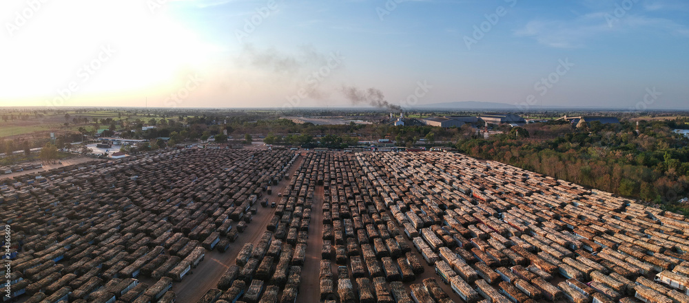 aerial view from drone trucks loaded with sugar cane in a truck parking outside sugar cane factory. aerial view from drone trucks loaded with sugar cane in a truck parking outside sugar cane factory.