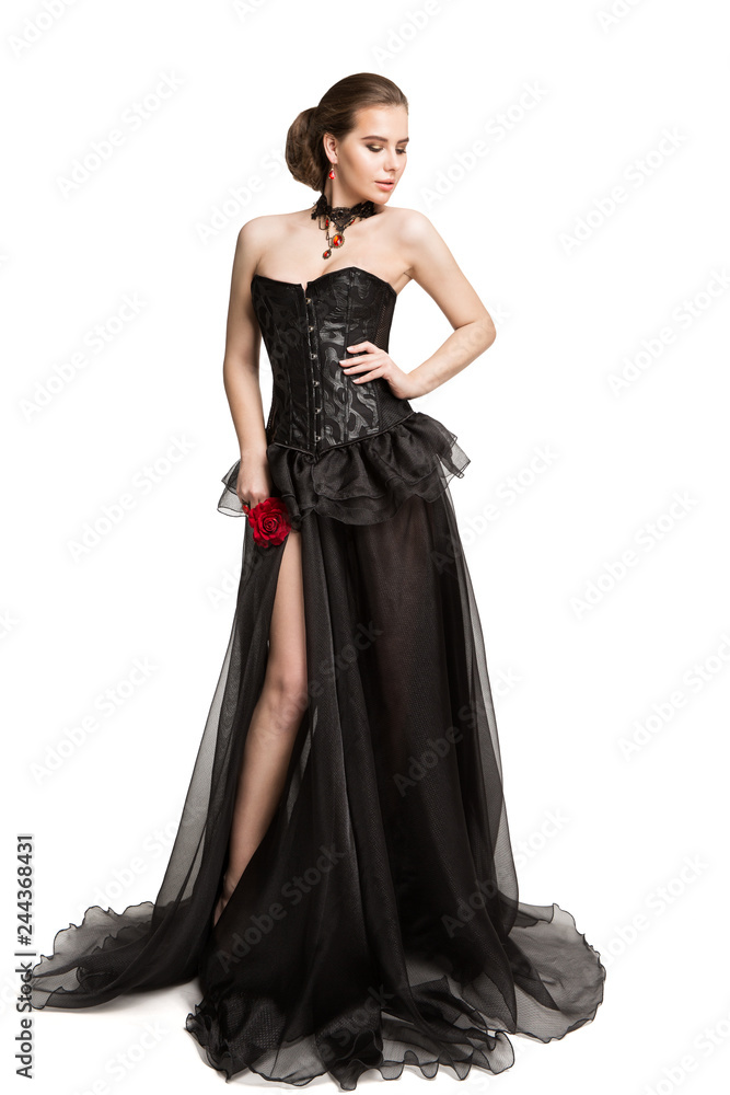 Fashion Model in Black Corset Dress holding Red Rose Flower, Beautiful Woman in Long Gown, Isolated over White Background