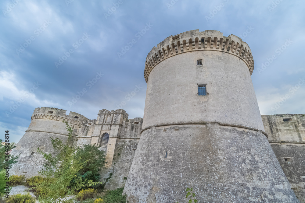 ruins of medieval old tower of castle under blue sky with cloud in Matera Italy ruins of medieval old tower of castle under blue sky with cloud in Matera Italy