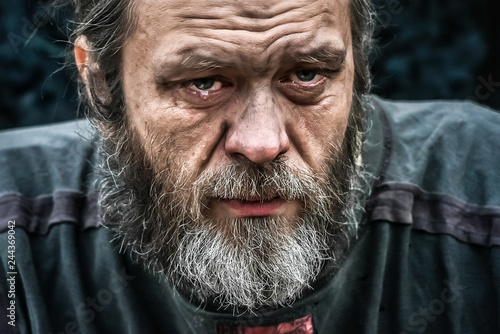 Homeless man crying portrait closeup