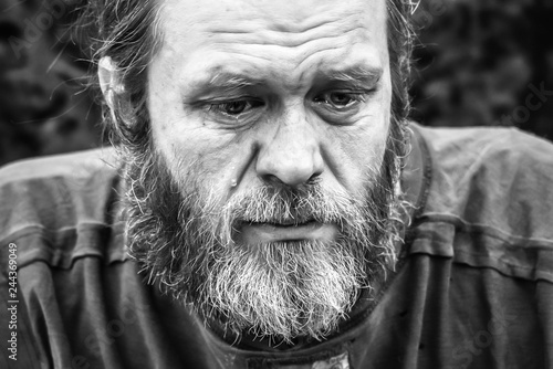 Homeless man crying portrait closeup
