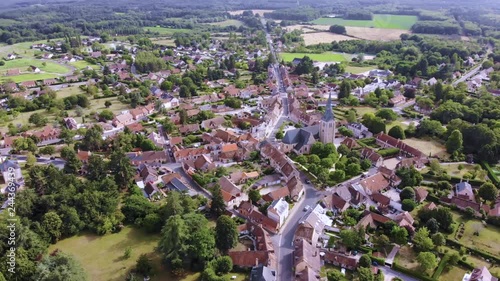 Aerial shot of a French village lost in the forest taken from a drone
