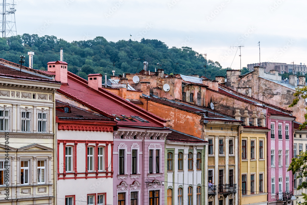 Historic Lviv, Ukraine cityscape with colorful architecture buildings in old town market square in sunset evening night multicolor houses