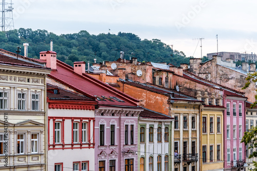 Historic Lviv, Ukraine cityscape with colorful architecture buildings in old town market square in sunset evening night multicolor houses