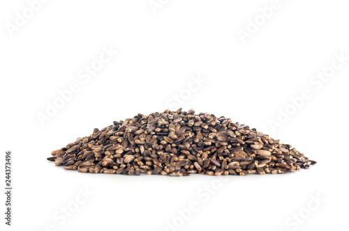 thistle seeds in a heap on a white background