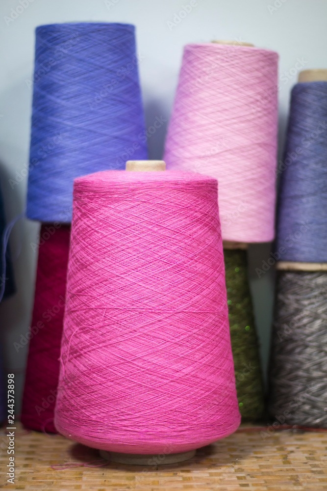 yarn on cardboard cones for use in knitting and clothing industry